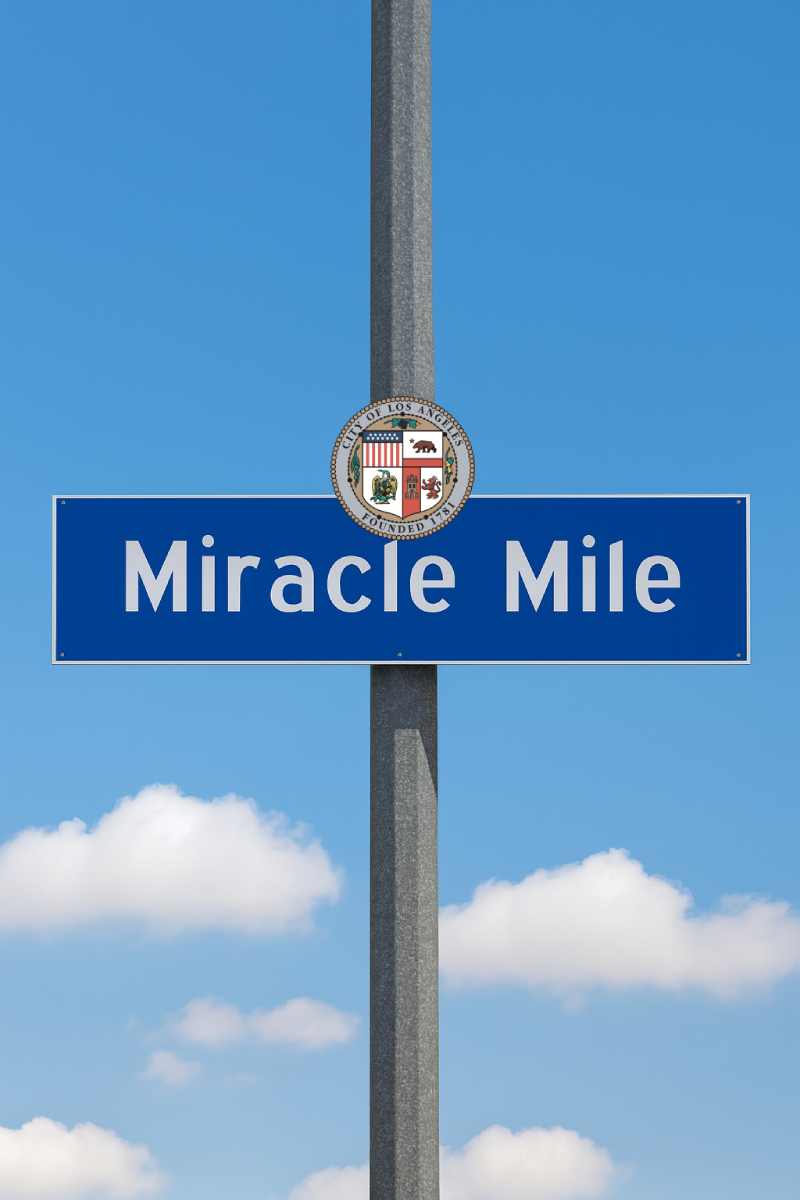 Miracle Mile Realtor Yild Guven Street Sign